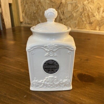 THL 7'' Sugar Canister White Embossed Floral Scroll Design & Pull Silver Label