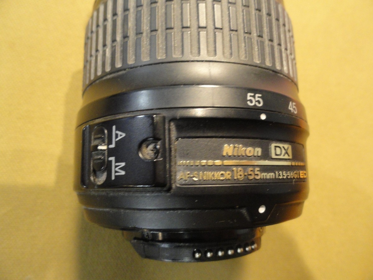 NIKON DX SWM ED ASPHERICAL 0.28M/0.92FT 52 US 6766543 18-55 MM 1
