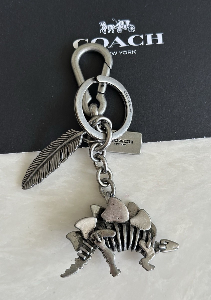 COACH STEGGY STEGOSAURUS & FEATHER NICKEL BAG CHARM KEYRING 65134