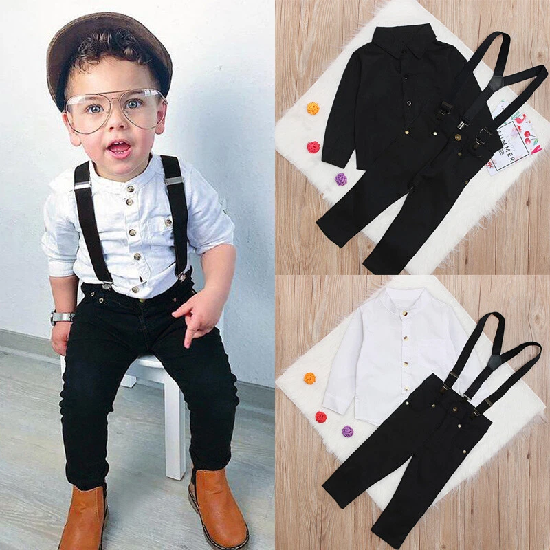 Cute little boy in a hat and trousers with suspenders  CanStock