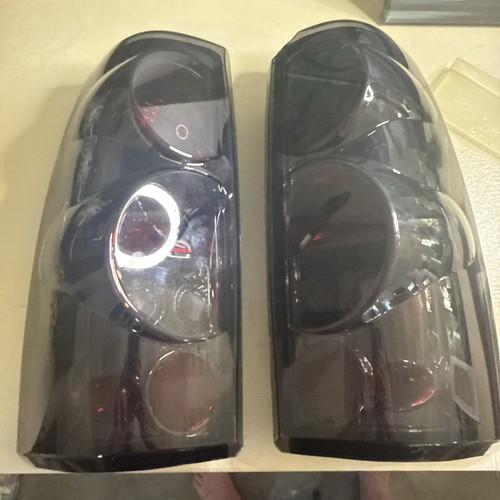 Smoked Halo Tail Lights Pair Fits 99-06 Chevy Silverado Tahoe Suburban GMC Used