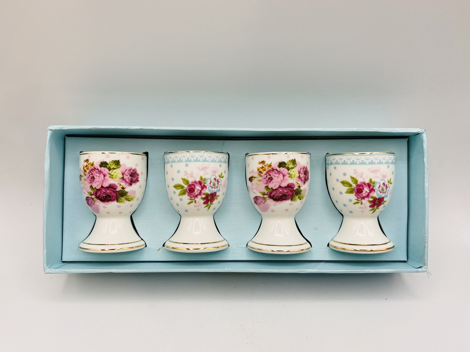 NIB Porcelain Victorian White, Pink, & Blue Roses - Footed Egg Cups 4 pc