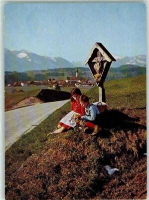 10235889 - 8210 Vachendorf Cross of the Way Mother and Son Take Break Flowers