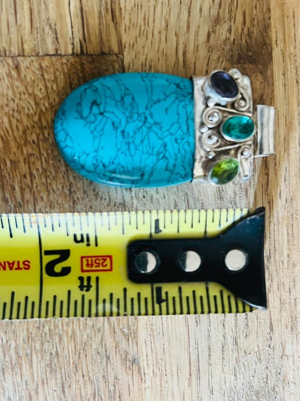 silver turquoise pendant two inches tall pre-owned but in good condition!