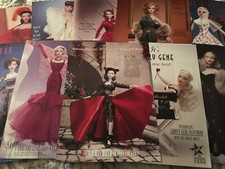 Lot of 9 Ads picturing Ashton Drake GENE Dolls Wearing Different Doll Outfits