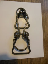 Large heavy metal brain teaser  puzzle 10" high