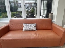 2 Orange Leather Sofas (DFS)