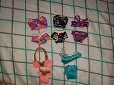 LOT OF BARBIE DOLL SWIMSUITS 11