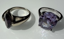 A pair Of Dress Rings Silver Colour. In Small Box. One Is Hall Marked.