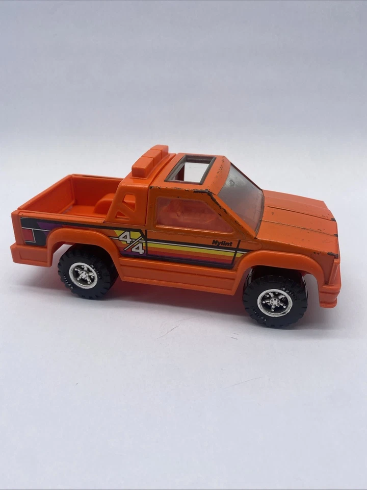 Camioneta pickup NyLint 1989 vintage 4 X 4 naranja acero prensado y plástico techo corredizo Foto 2 de 4
