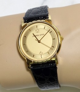 Montre Vintage Universal Genève - Cadran Doré à Bandes Blanches, Années 1950-60