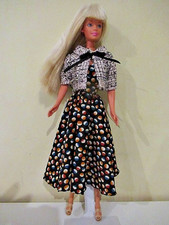 Barbie in polka dot dress with ring and earrings