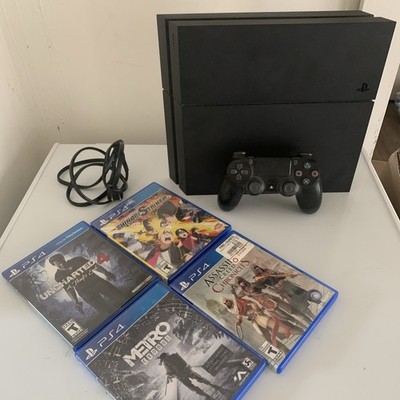 Sony PlayStation 4 PS4 (500 GB) Console - Black with 4 games and 1 Controller