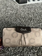 Cartera de tela jacquard firma Coach