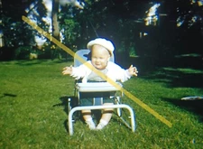 Vintage 1957 Red Border 35mm Slide Happy Baby Boy in Bounce Seat #22735