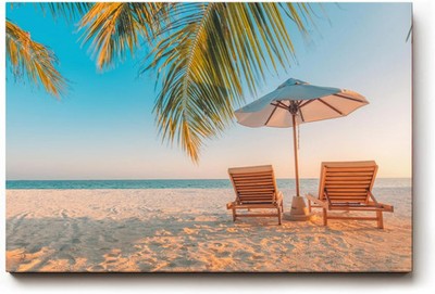 Sinus Art Wandbild Zwei Sonnenliegen am Palmenstrand mit Schirm vor blauem