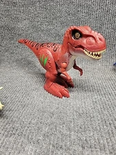 Robo Alive Attacking T-Rex Dinosaur Battery-Powered Robotic Toy by Dolgen 7"x12"