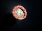 ROLL OF UNSEARCHED WHEAT PENNIES WITH 1909 AND A 1956D PENNY ON THE ENDS.