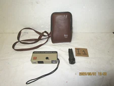 Vintage Kodak Hawkeye pocket Instamatic camera, storage pouch and flash extender