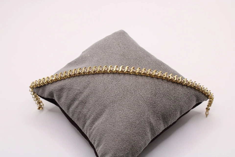 Brazalete de tenis de 7" de diamantes de corte redondo de 1,25 quilates de oro amarillo de 10 k de 7,7 gramos Foto 3 de 4