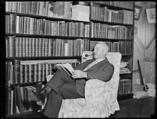Edward Granville Theodore sitting armchair next to bookshelf, NSW, - Old Photo