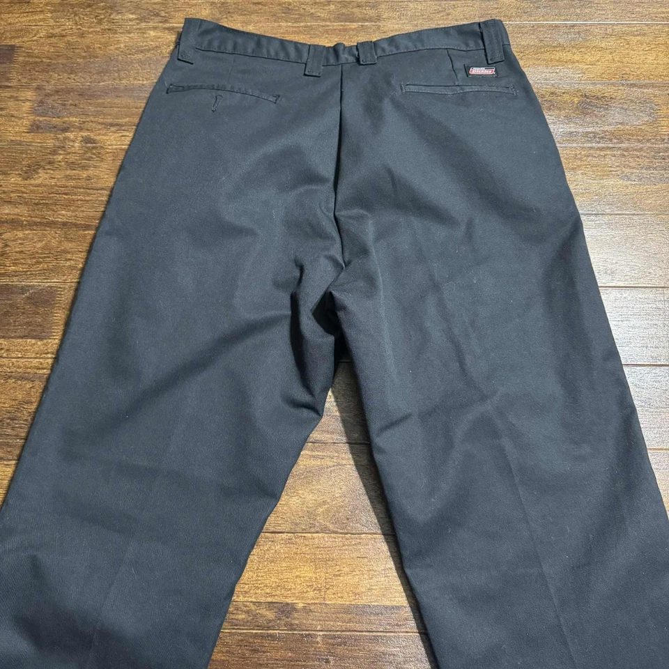 Pantalones chinos Dickies genuinos talla 34X34 negros calce regular pierna recta frente plano Foto 3 de 4