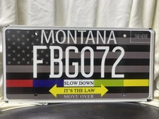 SLOW DOWN  IT'S THE LAW  MOVE OVER    MOVE OVER MONTANA  MONTANA LICENSE PLATE