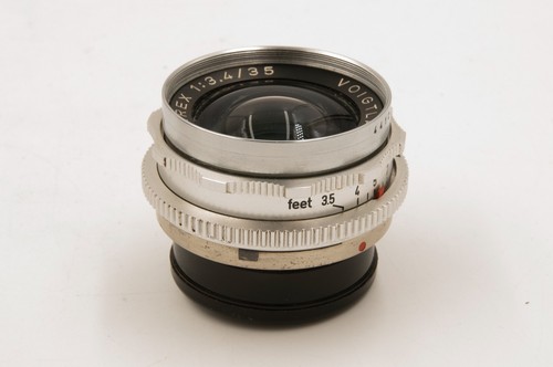 Montaje Voigtlander 35 mm f3,4 Skoparex DKL, con tapas, estuche, capucha y papeleo, en muy buen estado++ - Imagen 7 de 9