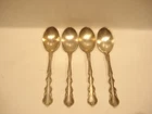 4 INTERNATIONAL STERLING SPOONS IN THE ANGELIQUE PATTERN