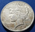 A 1926-D Peace Dollar 90% Silver $1 Dollar.  Nice High Grade