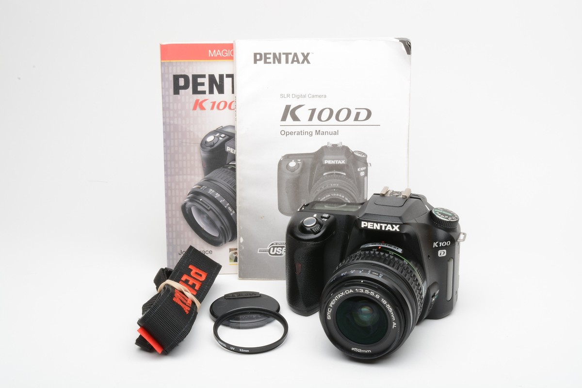 Pentax K100D DSLR w/18-55mm f3.5-5.6 zoom, manuals, book, strap