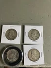 Lot Of Four l Franklin Half Dollars.