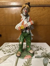 Ceramic Bisque Creepy Weird Hobo Clown Figure Playing A Harmonica  W/Red Nose.