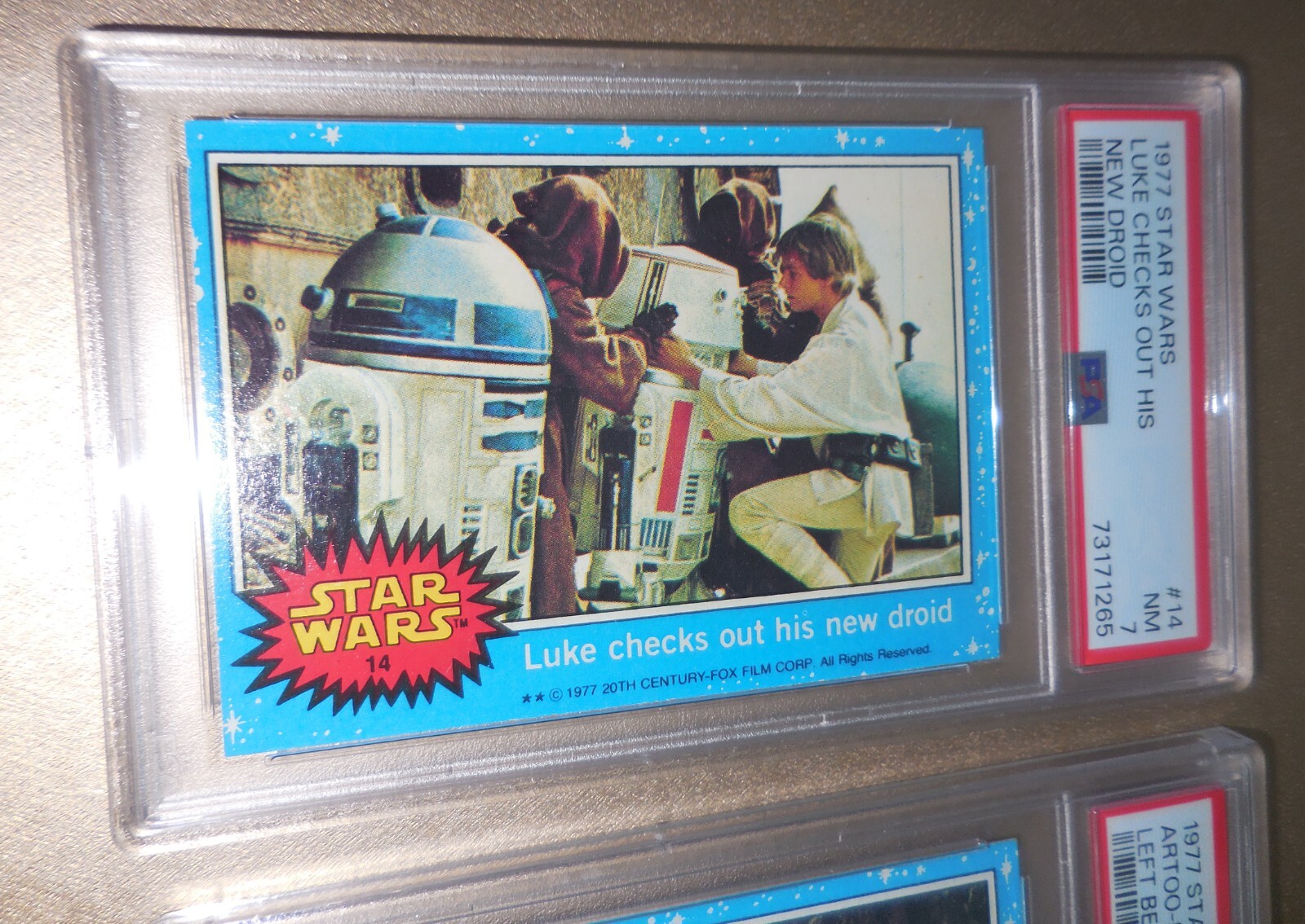 1977 Topps Star Wars #14 Luke Checks Out His New Droid PSA 7 Near MINT