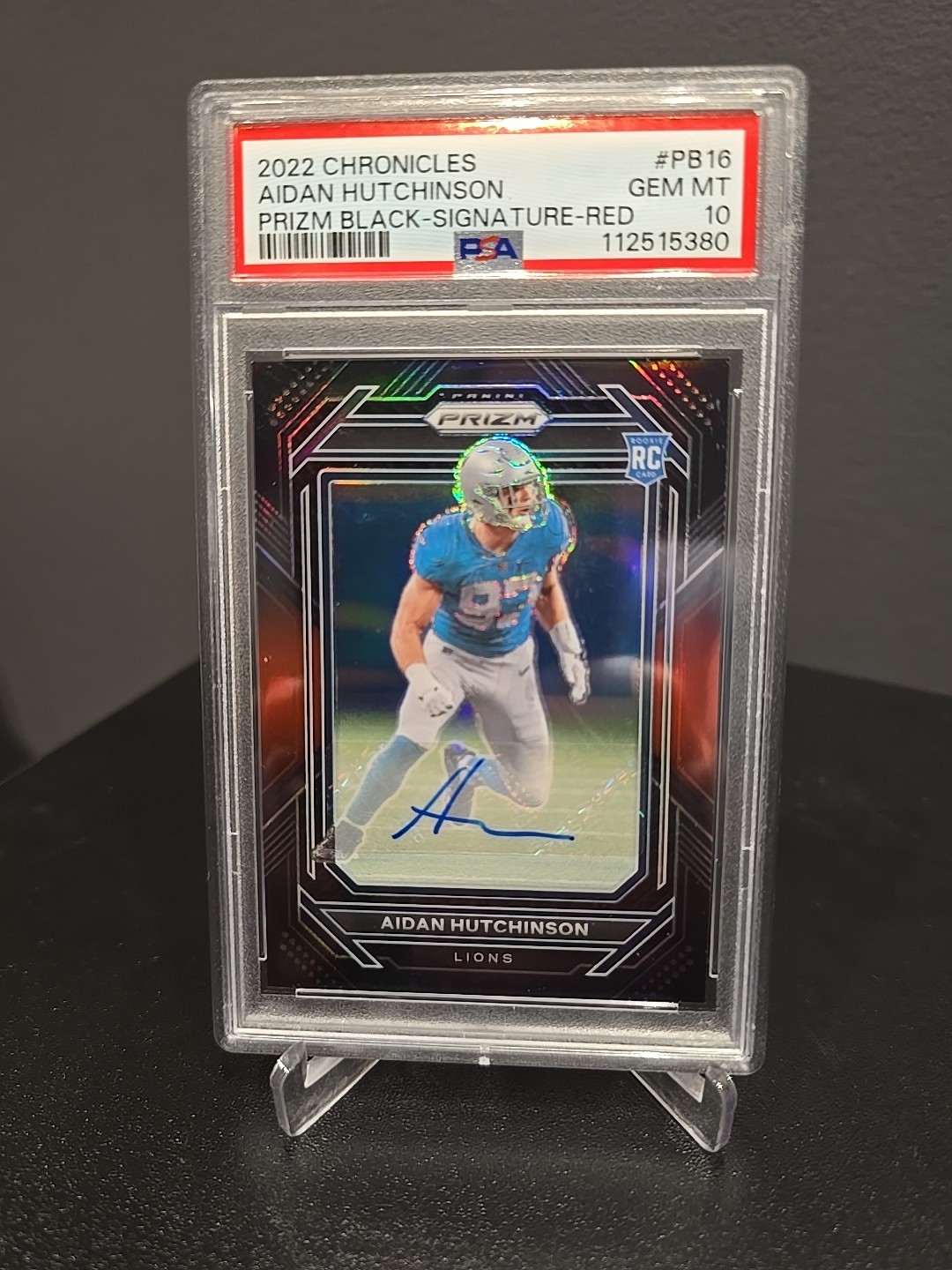 2022 Panini Chronicles - Prizm Black Aidan Hutchinson #PB-16 Red Signatures /99