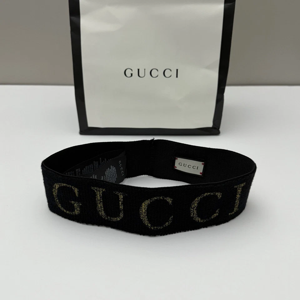 Auténtica diadema Gucci metálica con logotipo de lúrex negra dorada elástica Italia talla única Foto 2 de 4