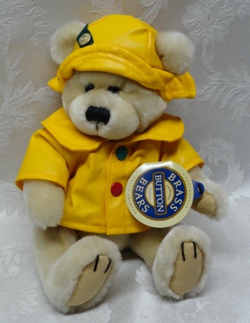 teddy bear in yellow raincoat