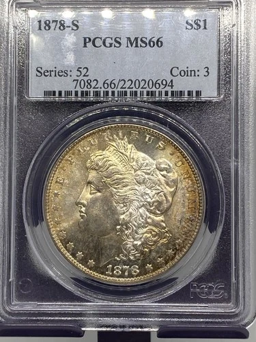 1878s MORGAN SILVER DOLLAR PCGS MS66. OBVERSE HAS A LIGHT GOLD COLOR TONE TO IT.