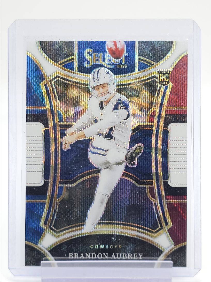 BRANDON AUBREY 2023 SELECT SUITE LEVEL ROOKIE TRI-COLOR PRIZM RC /149 Q6129