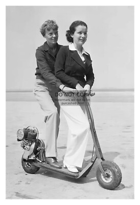 AMELIA EARHART AND JUNE RIDING ELETRIC SCOOTER TRAVIS 1935 4X6 PHOTO