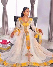 Elegant Ethiopian Traditional Dress with Yellow Tibeb and Cross Design