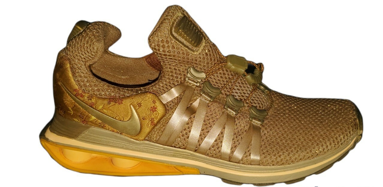 nike shox gravity metallic gold women's shoe