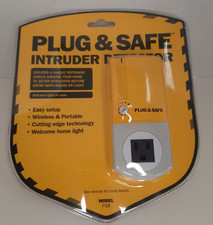 NEW factory sealed plug safe intruder detector activates lights or radio