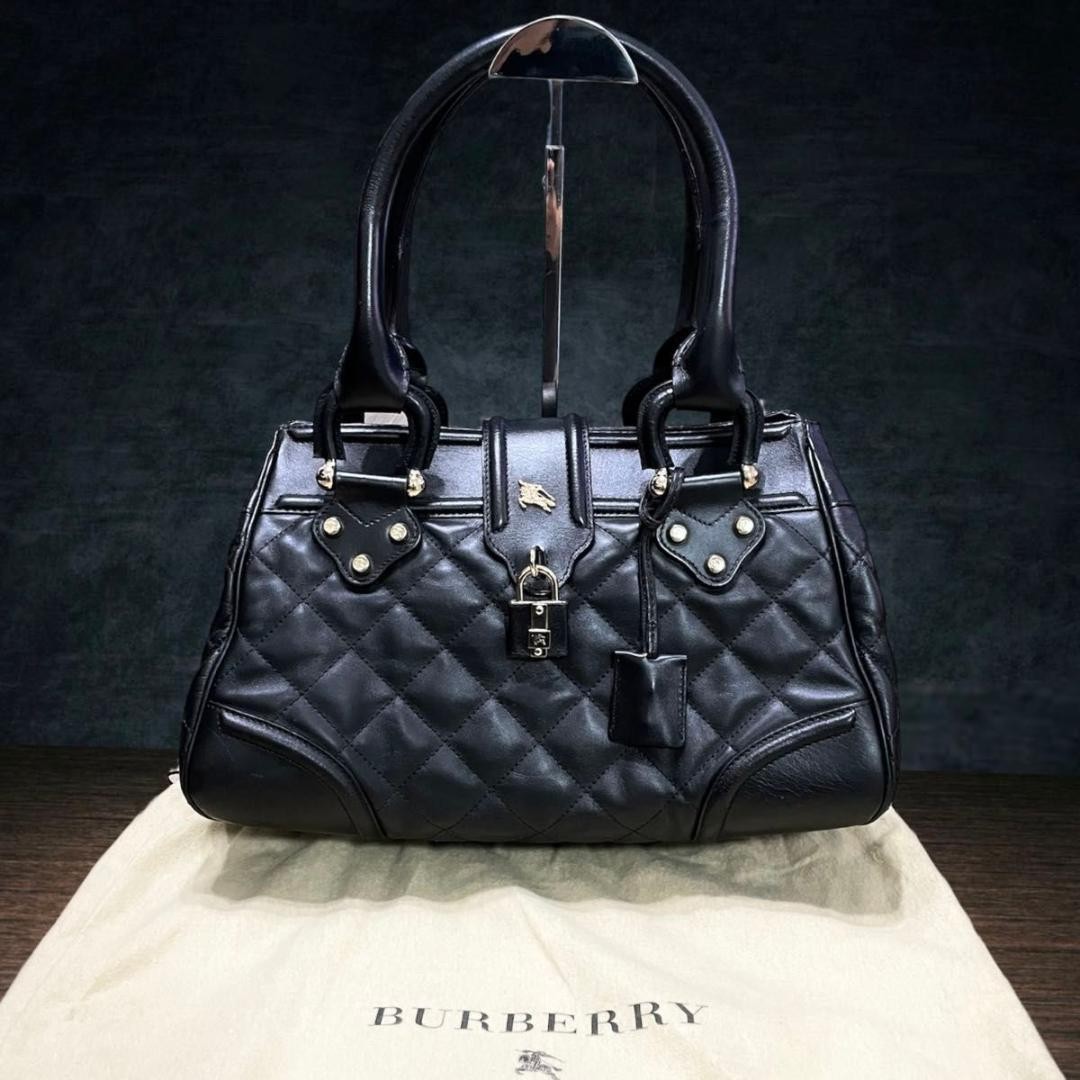 Bolso de mano de cuero Burberry negro acolchado dorado candado logotipo de ca...