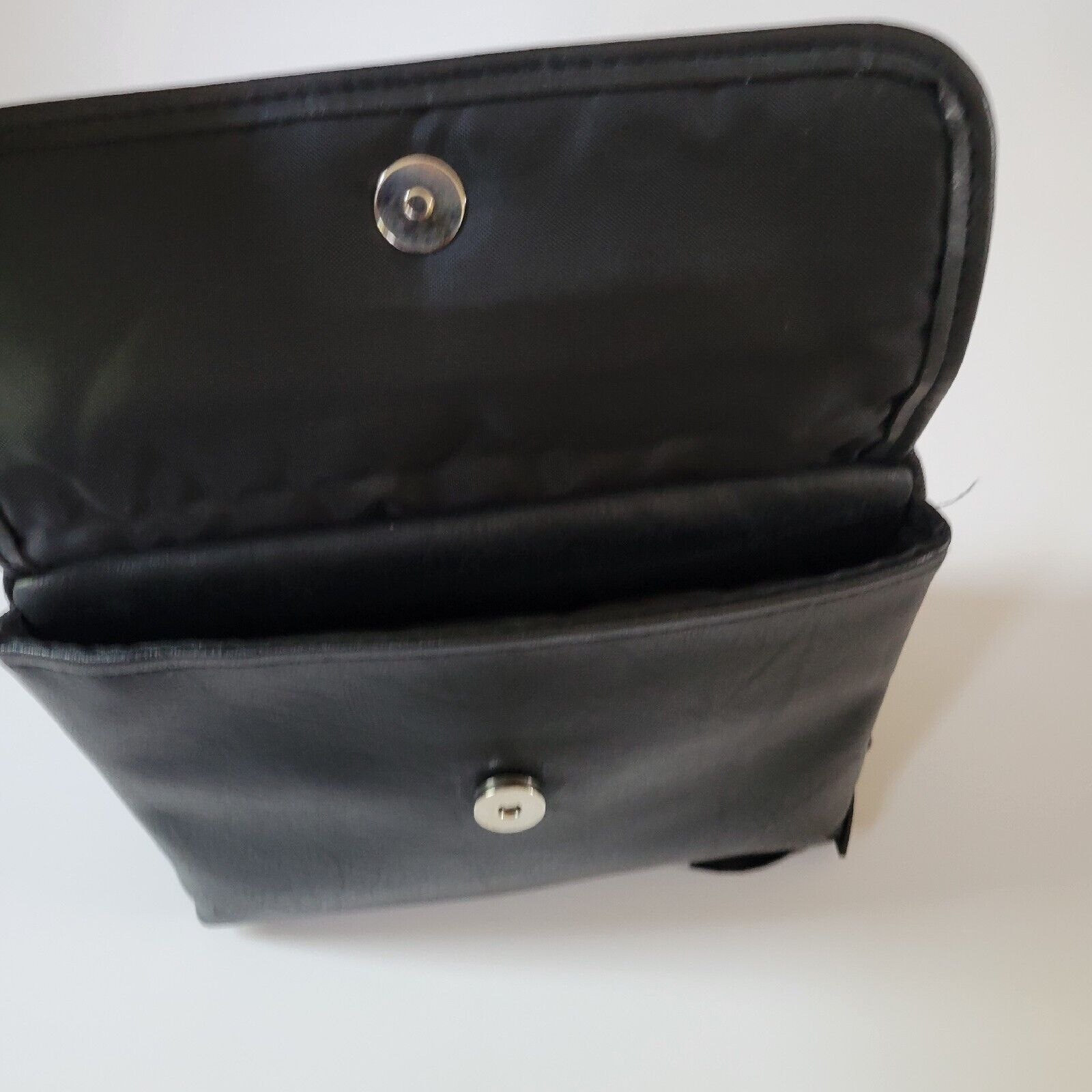 Portable DVD player in leather carrying case with built-in