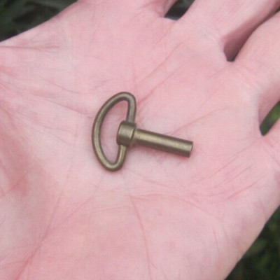 Music Box old brass winding key 5/8'' long post or shaft treaded winder