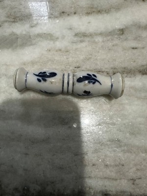 vintage blue and white ceramic handle, commonly found on copper kettles, teapots
