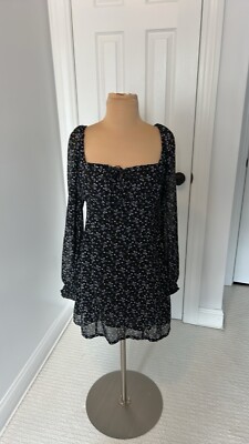 fitted black long sleeve mini dress The Eyelet Mini Tank Dress. -- Black – The Great main image 0