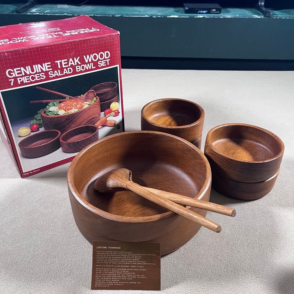 A complete 7-piece teak salad set still in its original box — rare to find intact and ready to actually use or display.