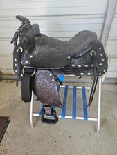 A Used Dark Oil Color 15" leather Chattanooga Trail saddle w/ Silver Triangles